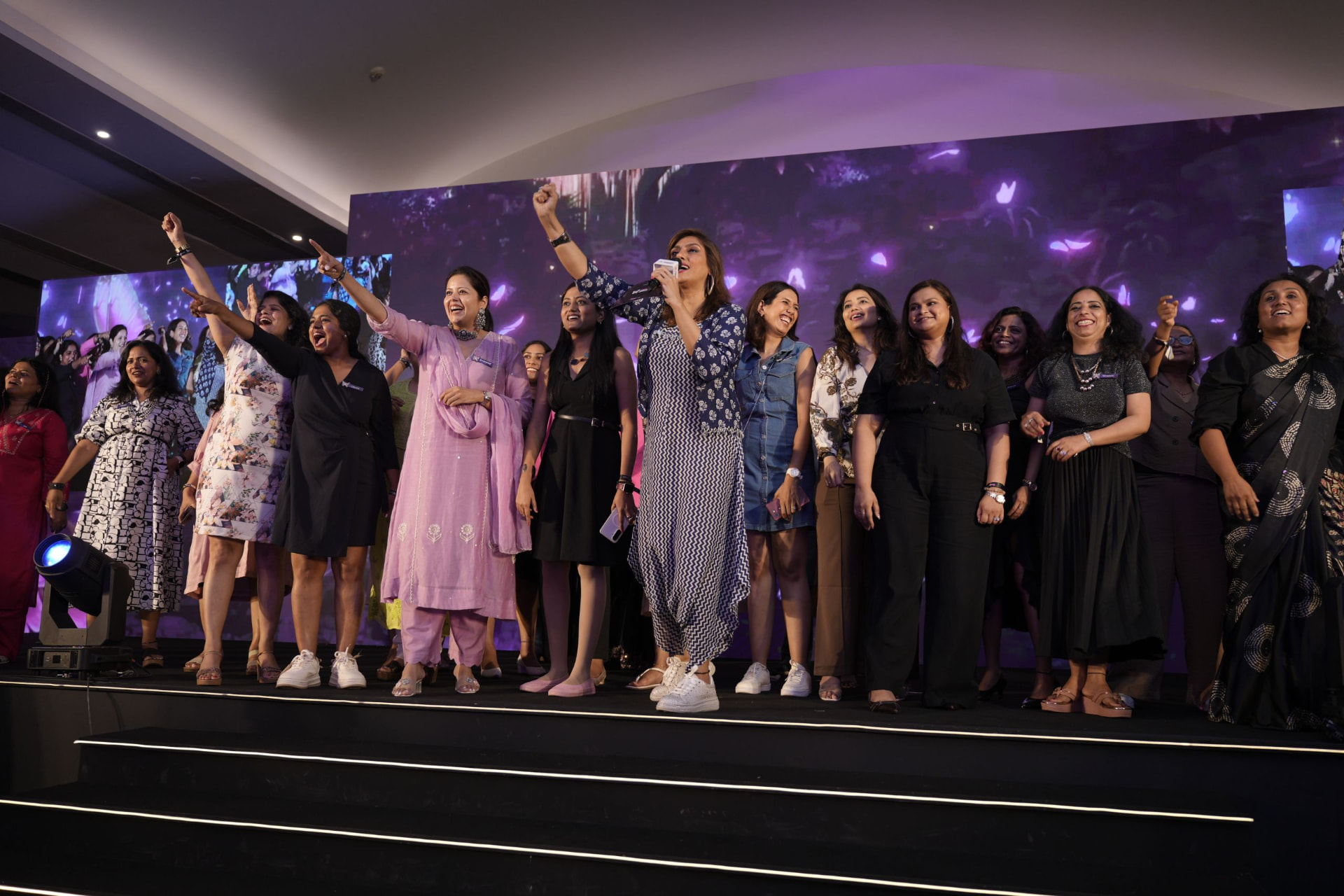 Women celebrating together at a Style Power Club community event